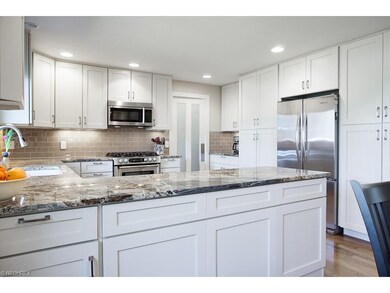The kitchen features high grade granite, soft clos