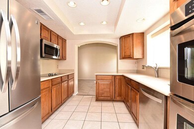 Kitchen has stainless steel appliances.