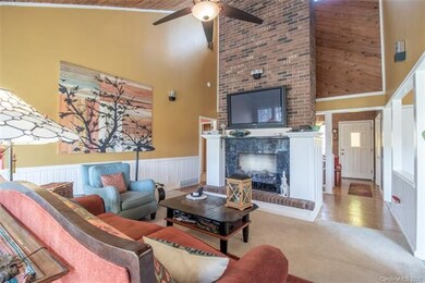 The vaulted living room and fireplace.