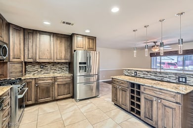 Kitchen with stainless steel appliances, tasteful