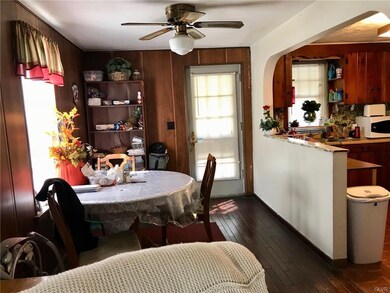 Open concept living room/dining/kitchen.