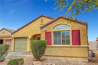 View of front of home with stucco siding, fence, a