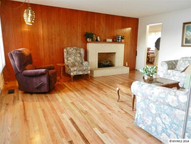 Refinished Hardwood floors. Wood fireplace.
