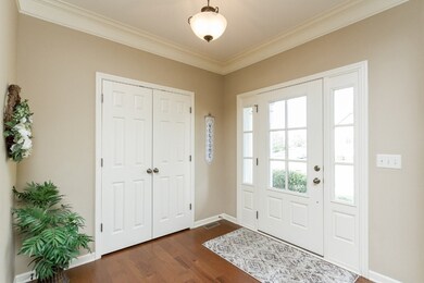 Inviting foyer with large coat closet.