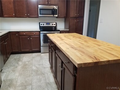 View from dining room: ceramic tile floor, granite