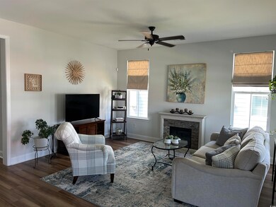 Living room designed with open concept for great entertainment .