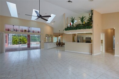Unfurnished living room with high vaulted ceiling,