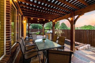 Patio terrace at dusk featuring outdoor dining area, a fenced backyard, a patio, a pergola, and area for grilling
