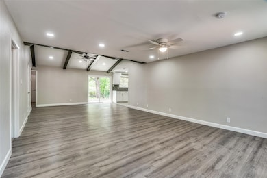Unfurnished living room with beam ceiling, recessed lighting, light wood finished floors, and ceiling fan