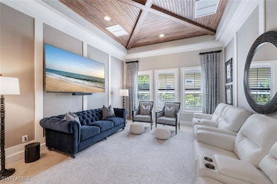 Living area with wood ceiling, recessed lighting,