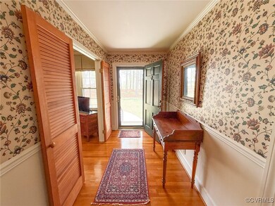 Entryway featuring light wood-style flooring, crow