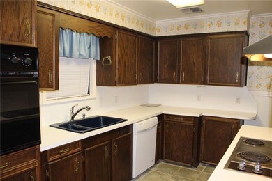 KITCHEN: ROOMY WITH LOTS OF CABINETS FOR PLENTY OF