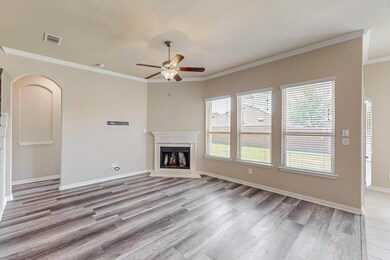 Unfurnished living room featuring crown molding, c