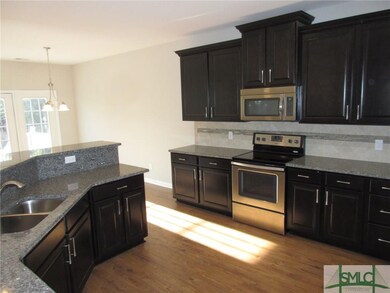 Kitchen with Granite Tops and Stainless Appliances