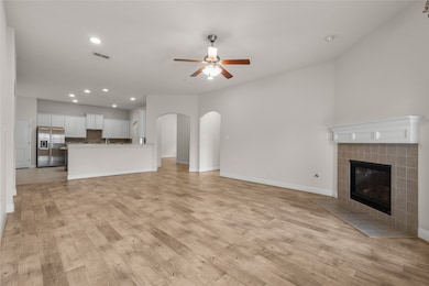 This spacious open-concept living area featuring w