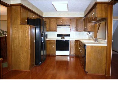 Kitchen with lots of cabinet space & pantry.