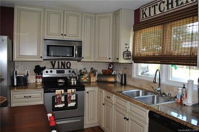 Granite countertops, stainless appliances, tile ba