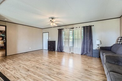 Living room featuring light wood-style floors, ce