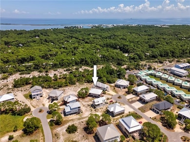 Backs up to the tall sand dunes.