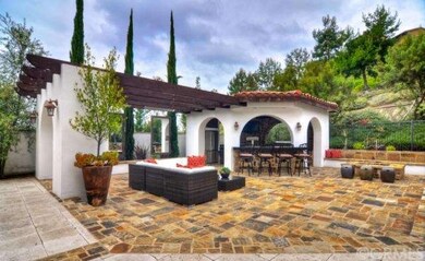 Stone patio, firepit and full outdoor kitchen