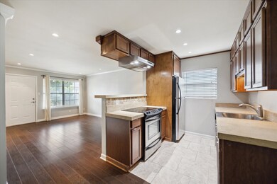 The window in the kitchen add more natural light.