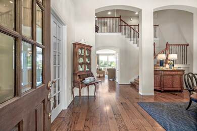 Step inside to high ceilings, warm wood floors and