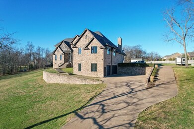 The home features a three car garage with a two (negotiable) car lifts for the auto enthusiast. 