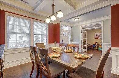 Dining room with coffered ceiling and wainscoting