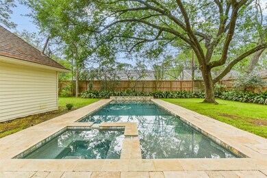 Tranquil backyard featuring a luxurious heated sal