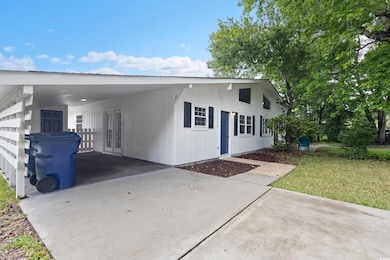 View of front facade with concrete driveway and a 