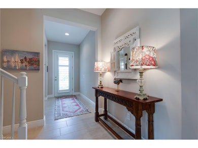 Beautiful natural light floods the foyer through t
