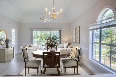 Dining area featuring ceiling fan with notable cha
