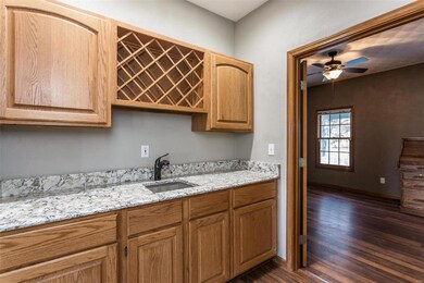 Butlers Pantry with Quartz Countertops and Wine Ra