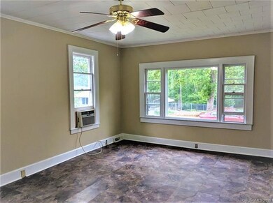 The large living room has new floors and a picture