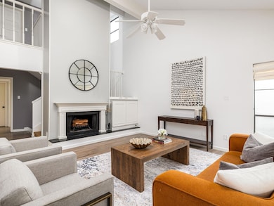 Living area with high vaulted ceiling, wood finis