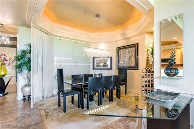 Dining room with coffered ceiling, glass wall, wal