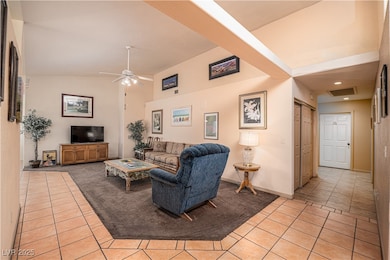 Living room with light tile patterned floors, a ce
