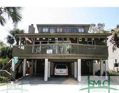 Exterior Front. Tons of covered parking.  Watch th