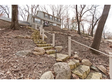 Professionally landscaped with limestone stairs, r
