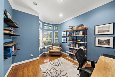 Private office with cool bay window located off the entryway on the first floor.