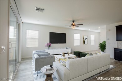 Family room has ample space and has wide plank LVP