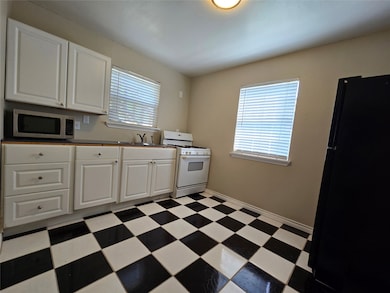The kitchen with classic black and white checkered