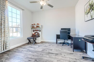 Office with ceiling fan, a healthy amount of sunli