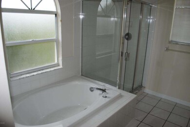 Master bath has garden tub and shower