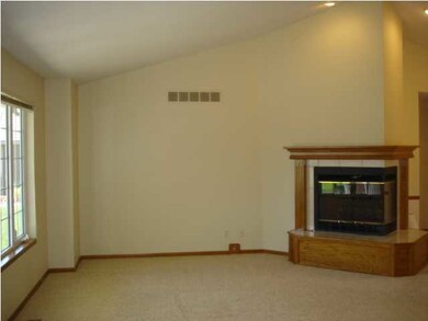 The gas/wood burning fireplace can be viewed from 