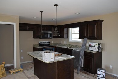 Open kitchen with granite countertops...