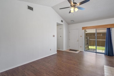 Unfurnished living room with lofted ceiling, wood