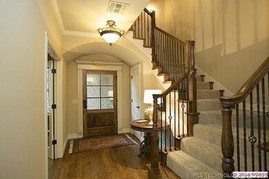 Entry Hall with hardwood floor, beautiful moldings