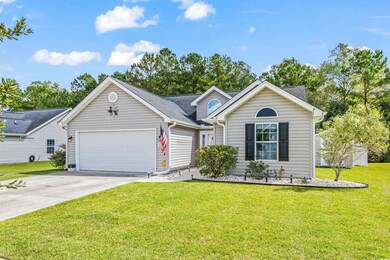 View of front of property featuring a garage and a