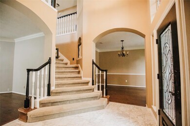 Striking foyer with access to dining room, family